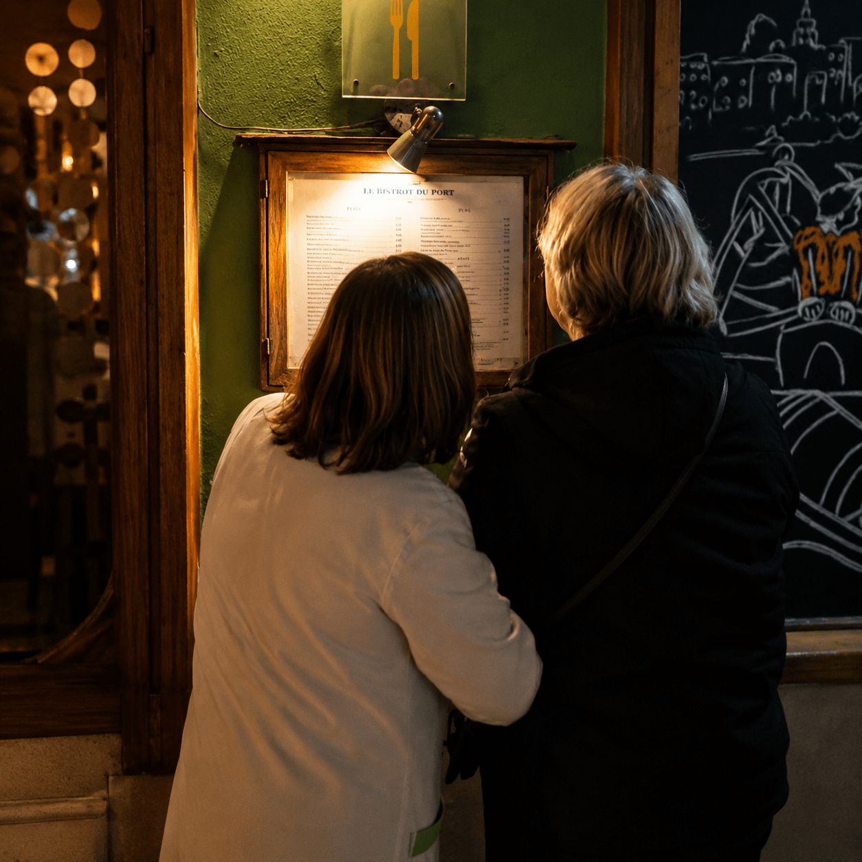 Late evening dinner dilemma. My cousin commandeering a local to explain the menu. Figuring out where to eat is becoming the evening’s main event