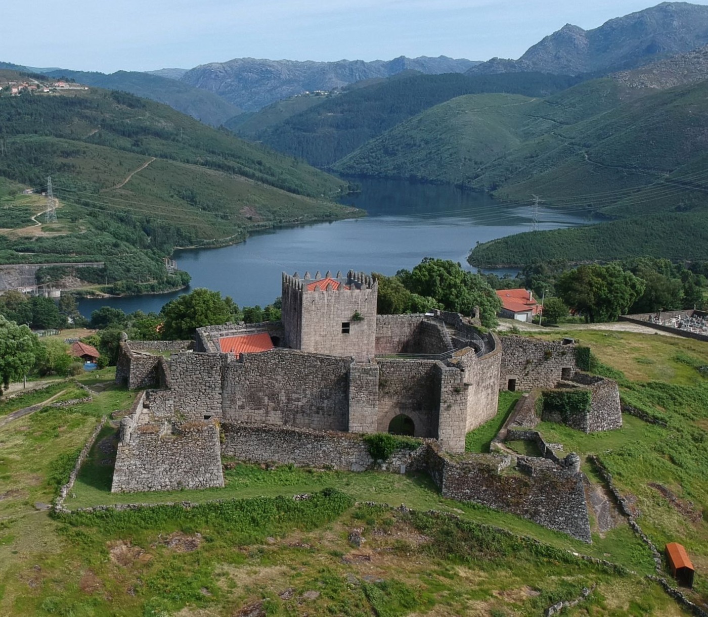 Medieval Lindoso Castle overlooking the Lindoso Reservoir and rugged mountains of Peneda-Gerês National Park, Portugal