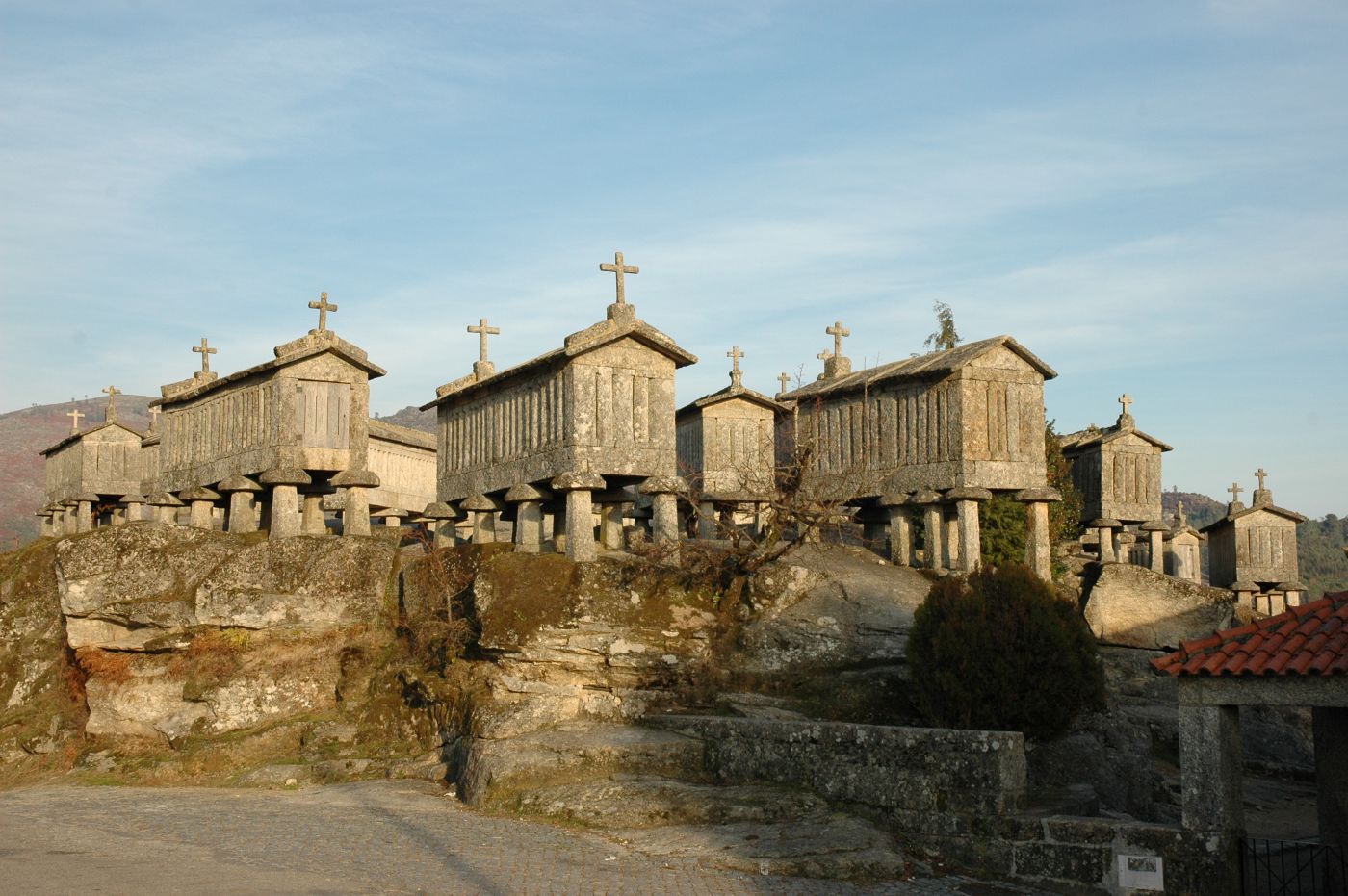Traditional espigueiros, raised granite grain stores topped with crosses, in the historic village of Soajo in Peneda-Gerês National Park, Portugal