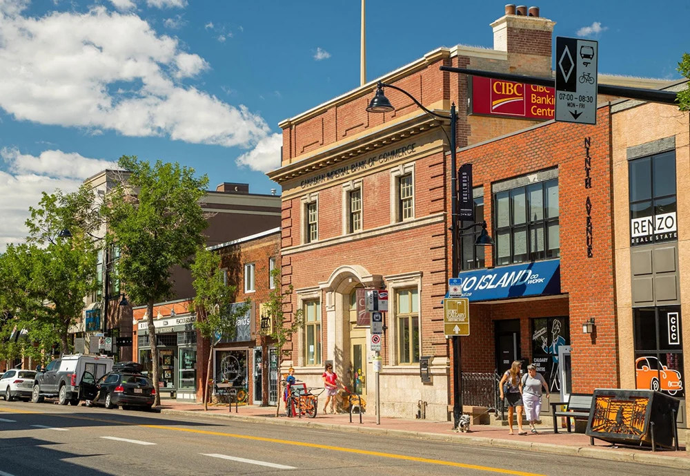 Historic brick buildings and local businesses along 9th Avenue SE in Calgary’s Inglewood neighbourhood