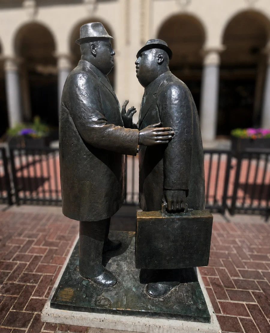 The Conversation sculpture depicting two businessmen talking on Stephen Avenue in downtown Calgary
